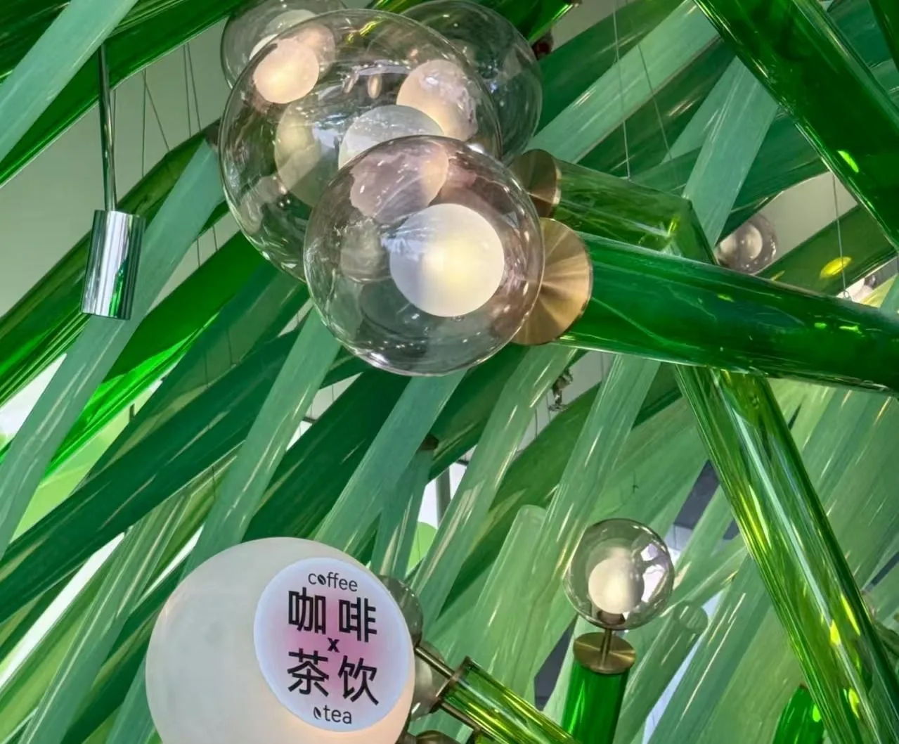 Transparent green sculptural detail at Guming